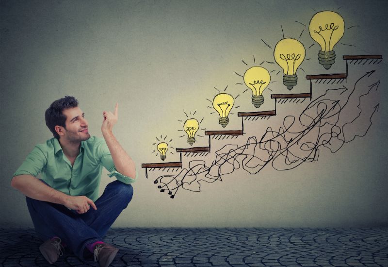 fast-marketing-translation-services-man-sitting-on-floor-in-office-pointing-at-business-education-success-promotion-company-growth-67169504-min