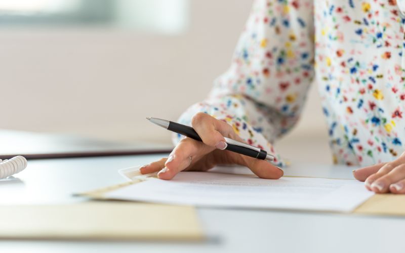 proofreading-services-woman-proofreading-contract-min