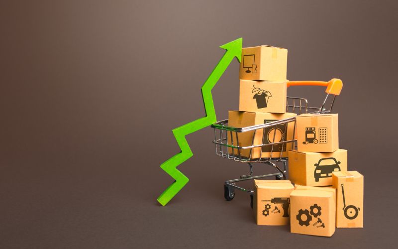 translation company-shopping-cart-with-boxes-and-green-up-arrow-growth-trade-production-increased-sales-rate-improving-consumer-sentiment-high-min