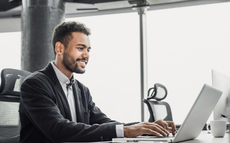 document-translation-services-south-africa-man-working-on-laptop-min